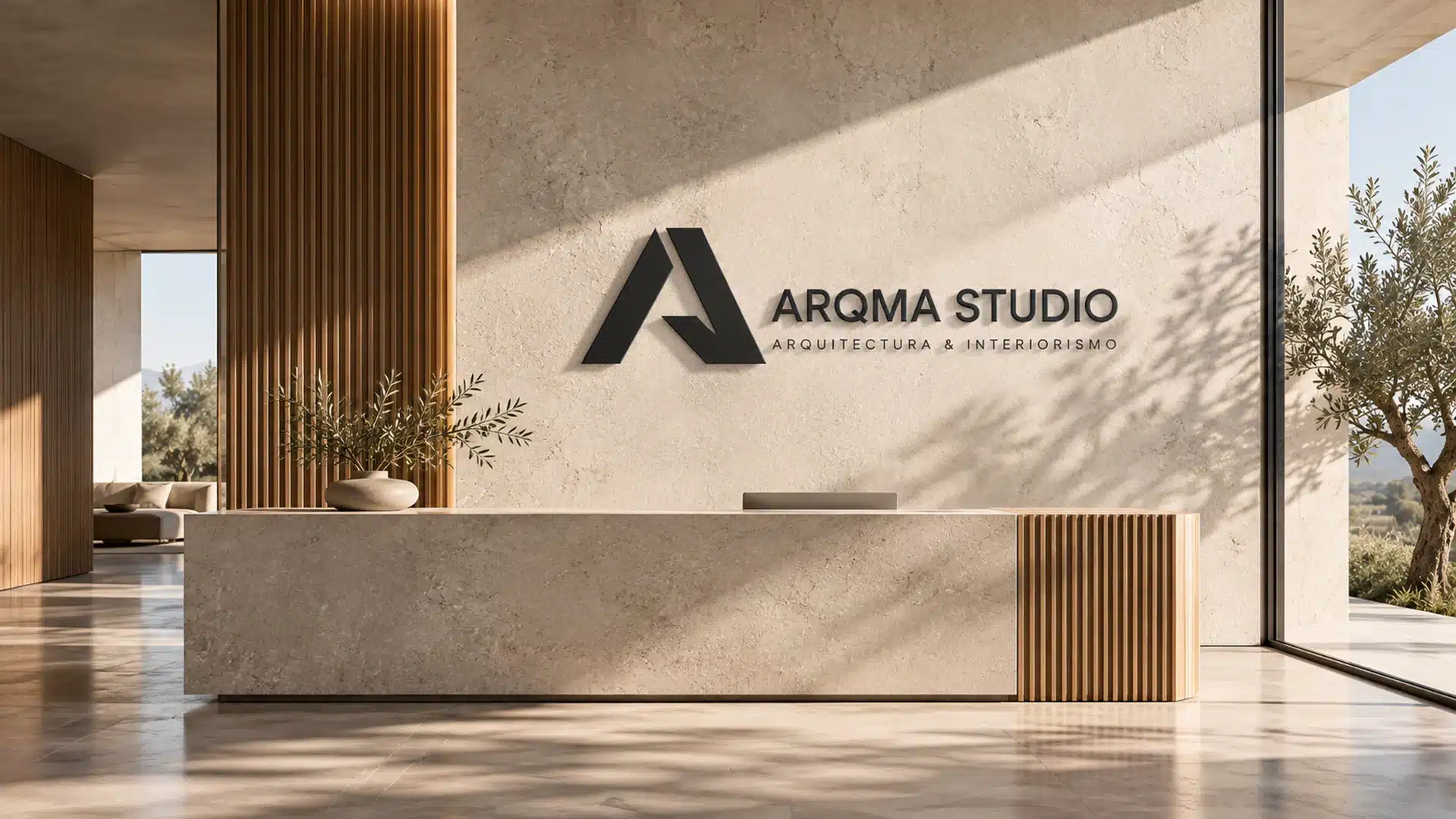 Aplicación física de la identidad de ARQMA STUDIO en un espacio arquitectónico